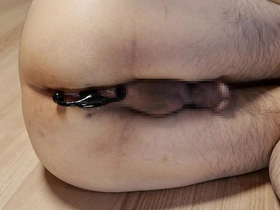Solo Asian man pleasuring himself with Progasm aneros prostate massagers in the living room.