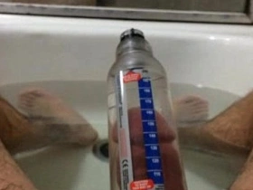 Solo boy tries out Bathmate to improve his penis size
