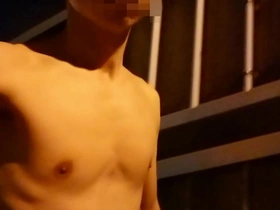 A solo boy’s daring night time naked walk on a pedestrian bridge in Japan.