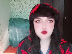 A petite transgender woman in a dress alone at home, craving for a partner